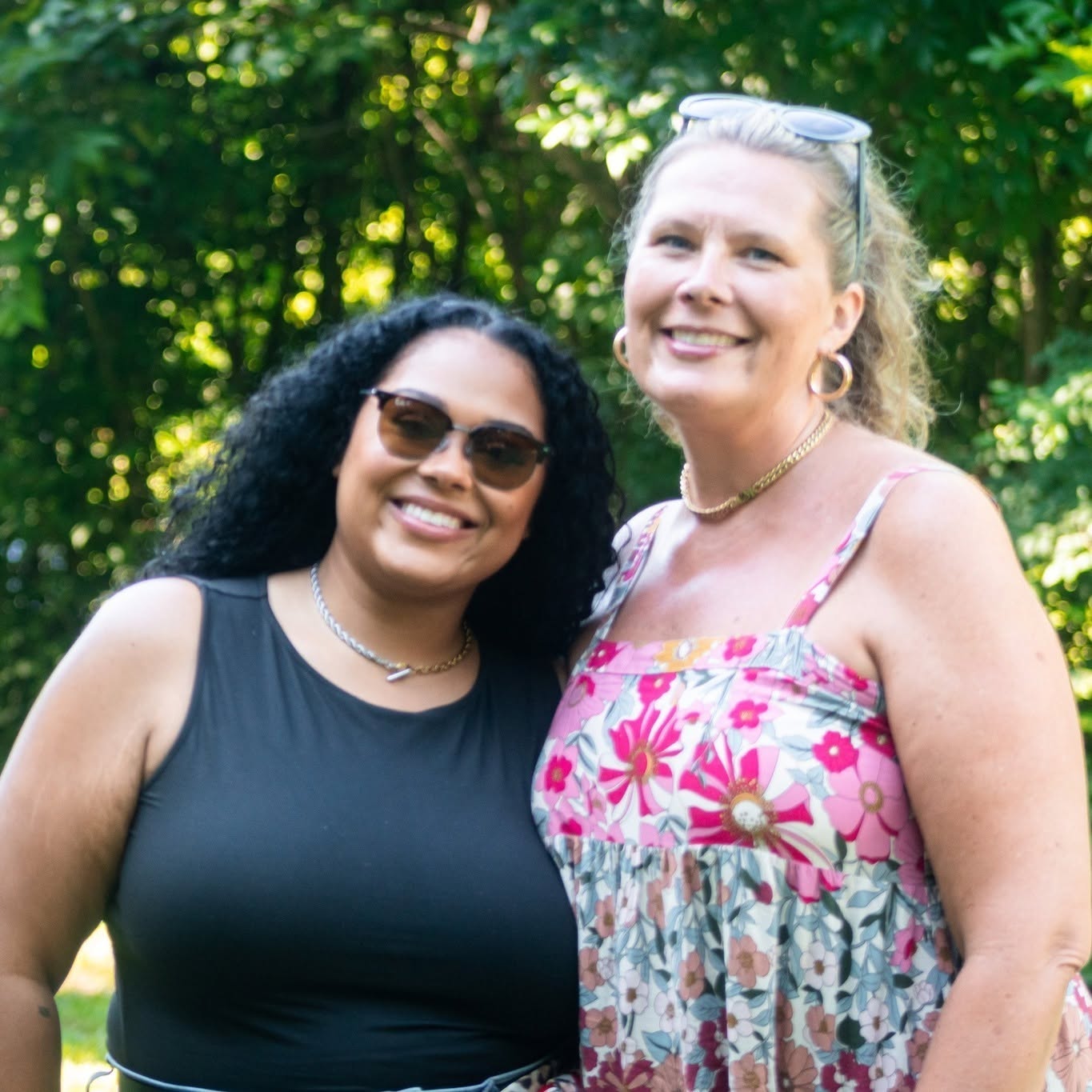 Two Ife Cultural Arts Center event attendees smiling outdoors